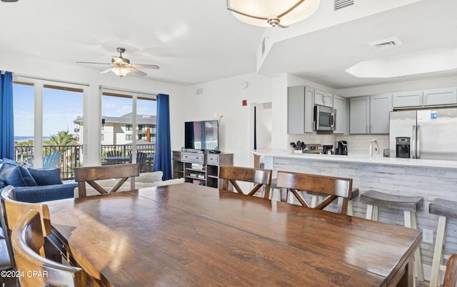 dining area with ceiling fan and billiards