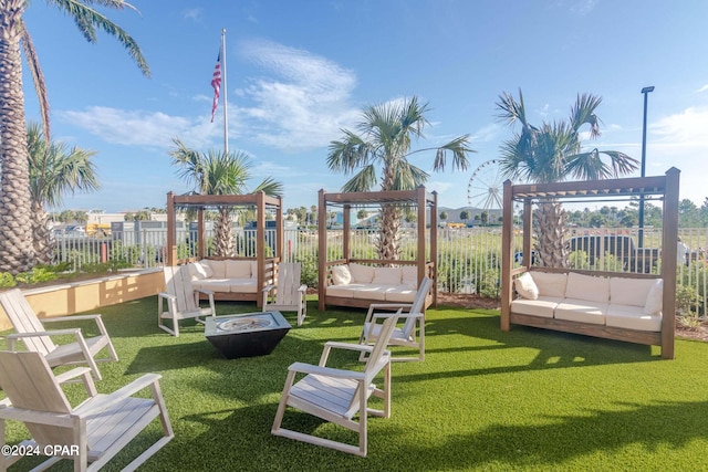 view of jungle gym featuring an outdoor living space with a fire pit and a lawn