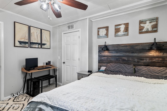 bedroom with ceiling fan, tile patterned flooring, and ornamental molding