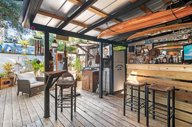 wooden terrace with an outdoor bar