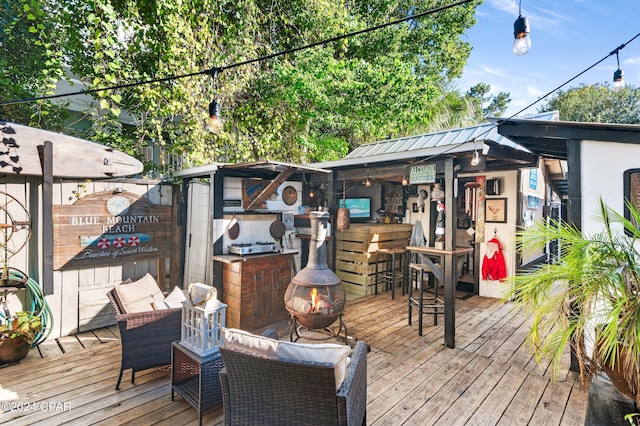 wooden deck featuring a bar