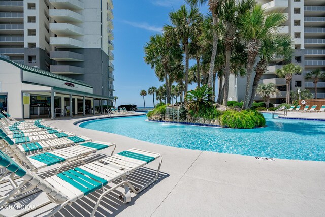 view of swimming pool featuring pool water feature