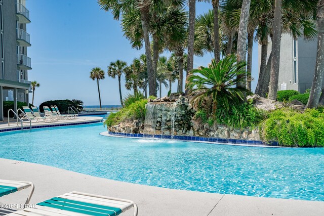 view of pool with pool water feature