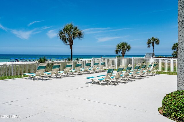 view of patio with a water view