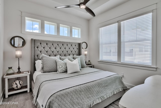 bedroom with ceiling fan and wood-type flooring