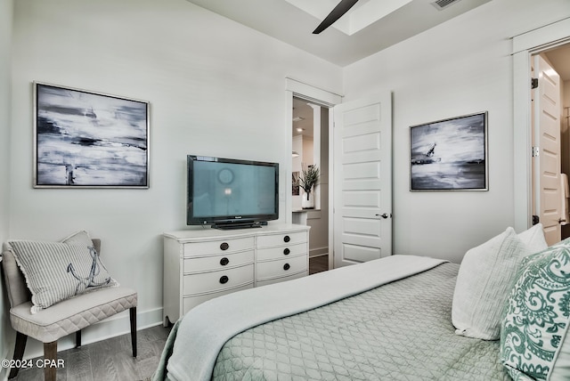 bedroom with ceiling fan and hardwood / wood-style floors