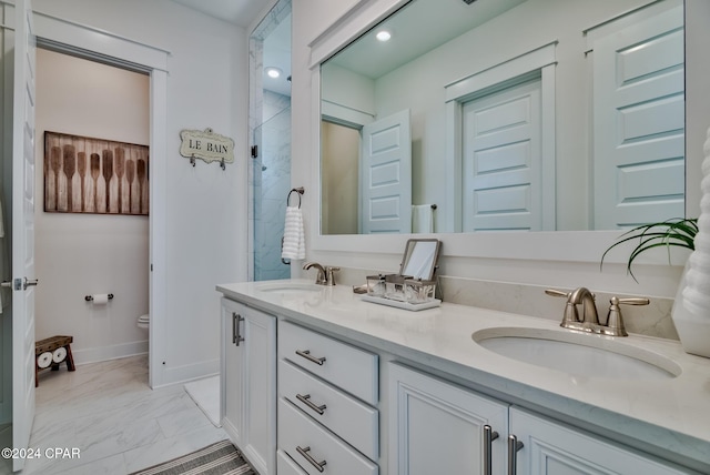 bathroom featuring toilet and vanity