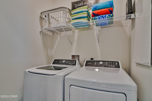 washroom featuring independent washer and dryer