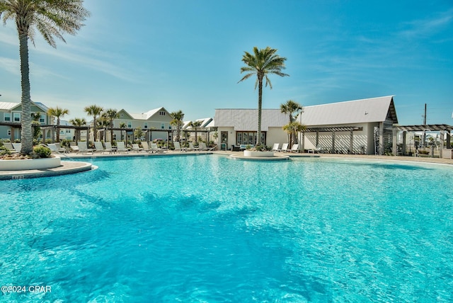 view of swimming pool with a pergola