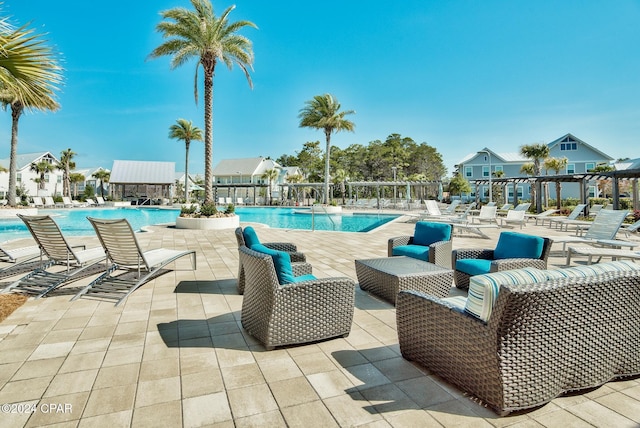 view of swimming pool featuring an outdoor hangout area, a pergola, and a patio