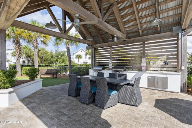 view of patio / terrace with ceiling fan, a gazebo, and area for grilling