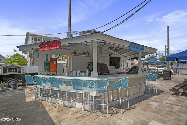 view of swimming pool with a gazebo and exterior bar