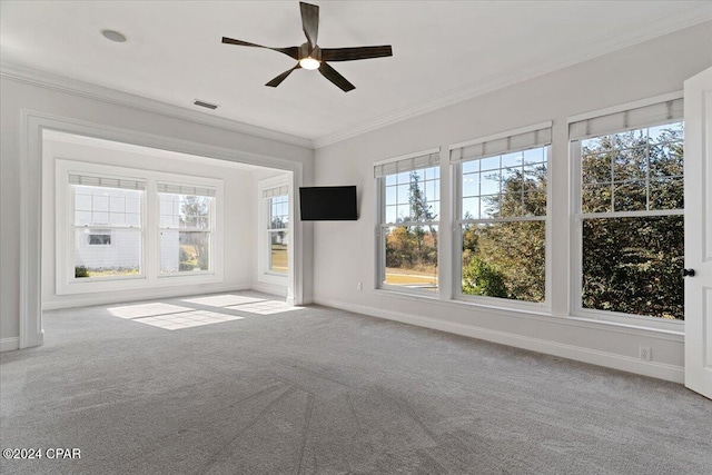 interior space with ceiling fan, crown molding, and light carpet