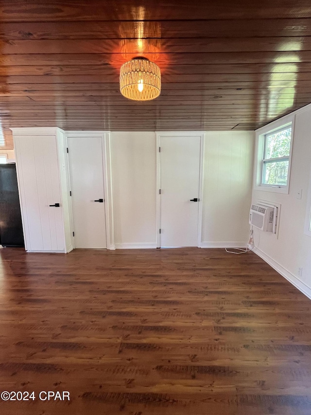 interior space featuring wooden ceiling, dark hardwood / wood-style floors, and a wall mounted AC