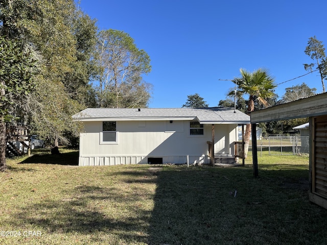 back of house with a yard