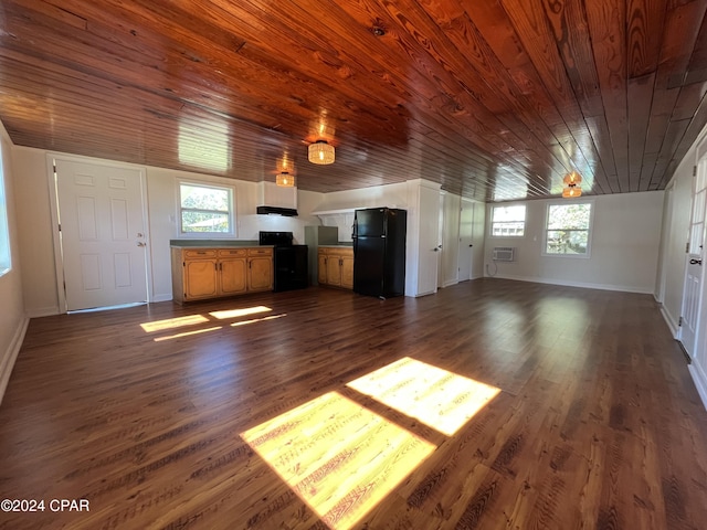 unfurnished living room featuring dark wood-type flooring, a wealth of natural light, wood ceiling, and ceiling fan