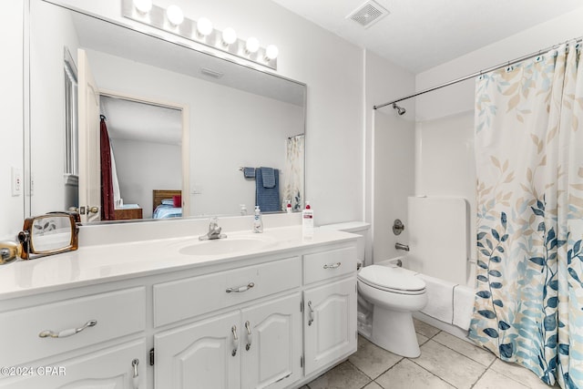 full bathroom featuring toilet, vanity, tile patterned flooring, shower / bath combo, and a textured ceiling