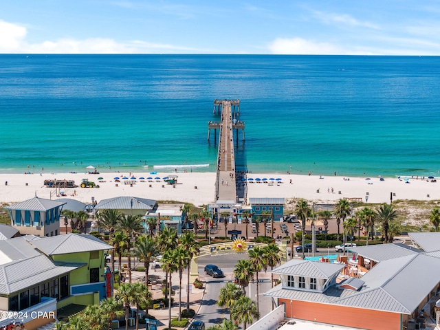 bird's eye view featuring a water view and a beach view