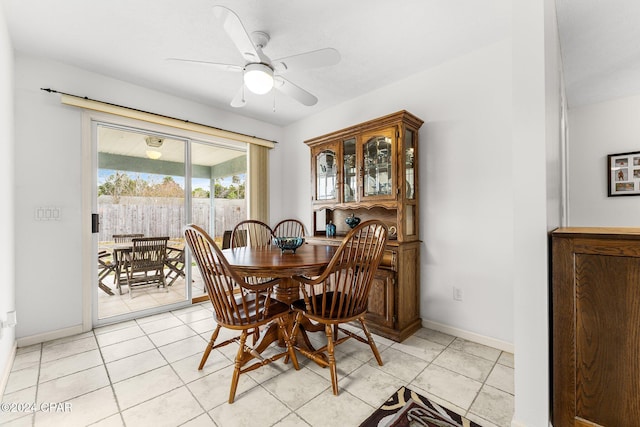 dining area featuring ceiling fan and light tile patterned floors