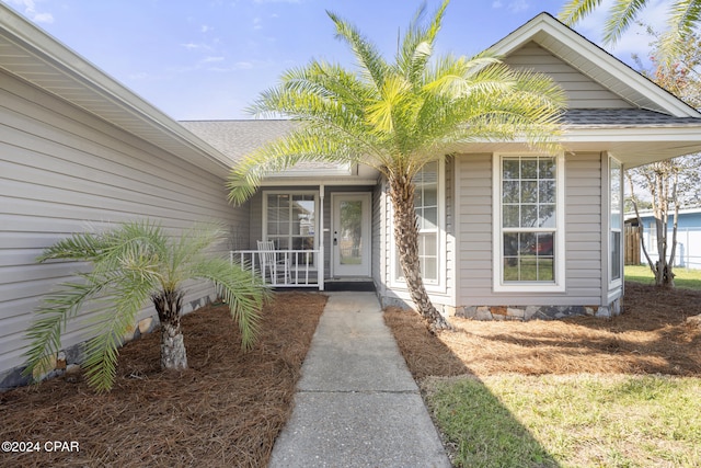 entrance to property with covered porch