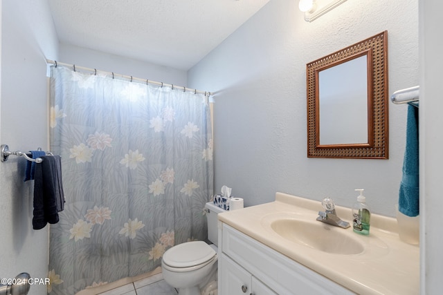 bathroom featuring walk in shower, a textured ceiling, vanity, tile patterned flooring, and toilet