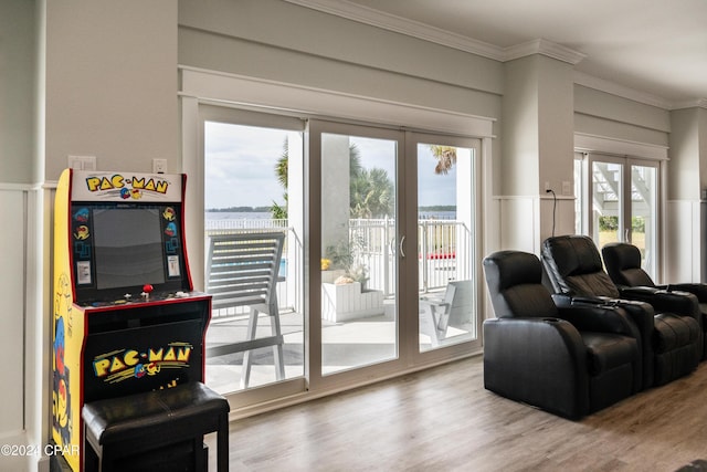 living room with french doors, crown molding, and hardwood / wood-style floors