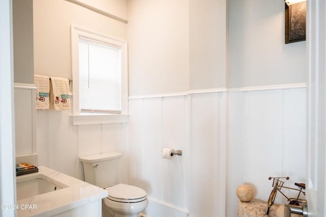 bathroom with toilet and vanity