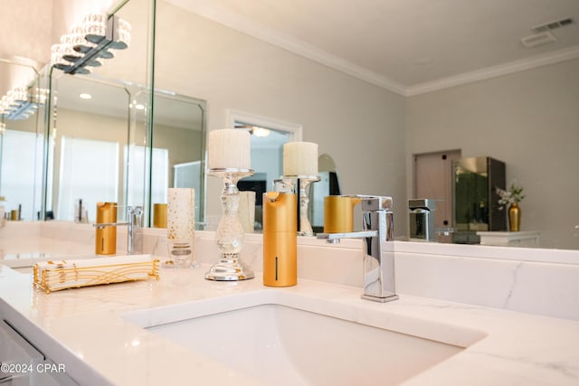 bathroom with vanity and crown molding