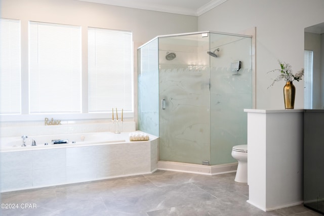 bathroom with toilet, ornamental molding, and shower with separate bathtub