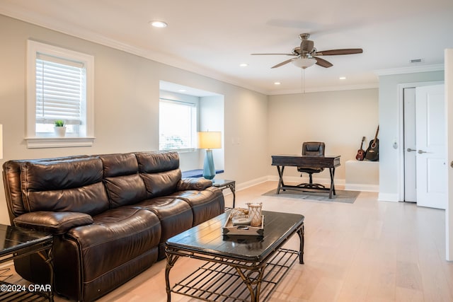 living room with ceiling fan, crown molding, and light hardwood / wood-style flooring