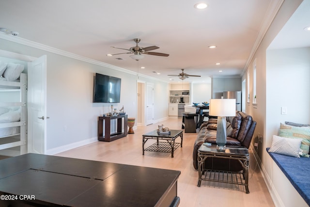 living room with ceiling fan, ornamental molding, built in features, and light hardwood / wood-style flooring