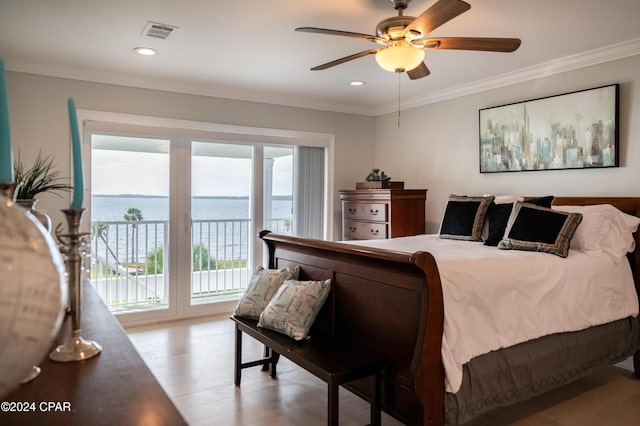 bedroom featuring access to exterior, a water view, ceiling fan, light hardwood / wood-style flooring, and crown molding