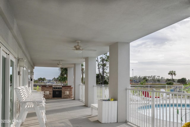 view of patio featuring ceiling fan and a fenced in pool