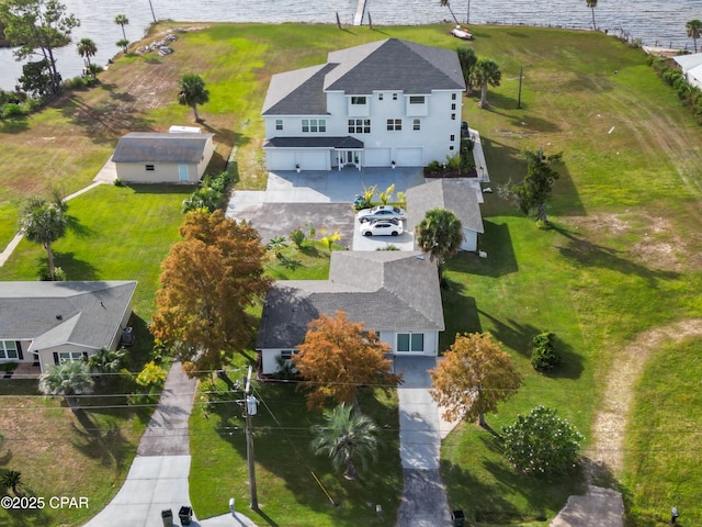 birds eye view of property featuring a water view