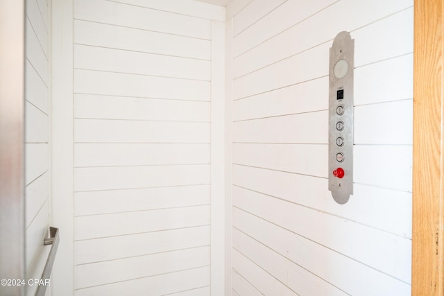 interior details featuring wooden walls