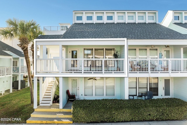 rear view of house featuring central AC unit