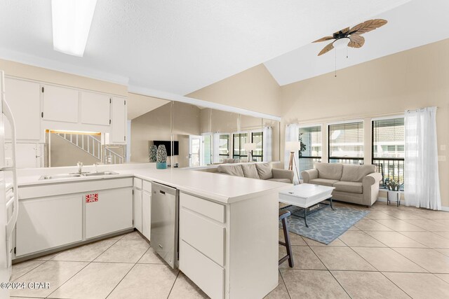 kitchen featuring dishwasher, white cabinets, sink, kitchen peninsula, and ceiling fan