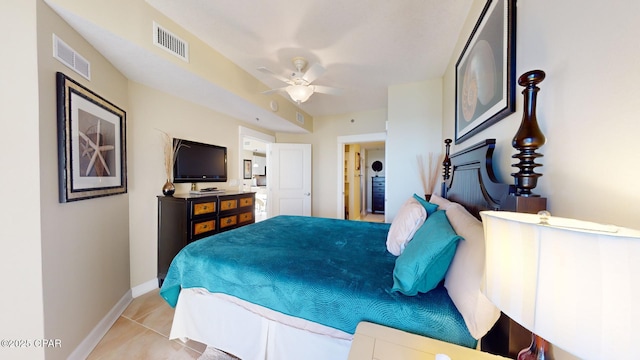 tiled bedroom featuring ceiling fan