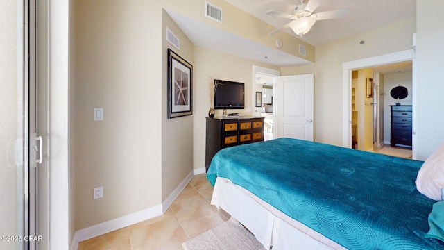 tiled bedroom with ceiling fan