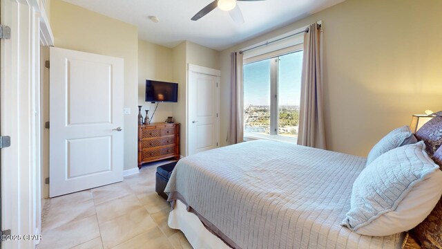 bedroom featuring ceiling fan and light tile patterned flooring