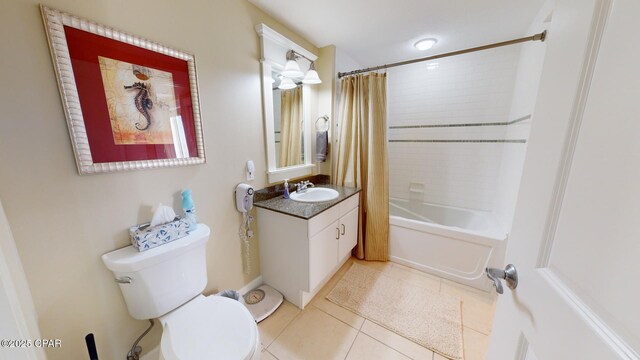 full bathroom with toilet, shower / bath combo, vanity, and tile patterned floors