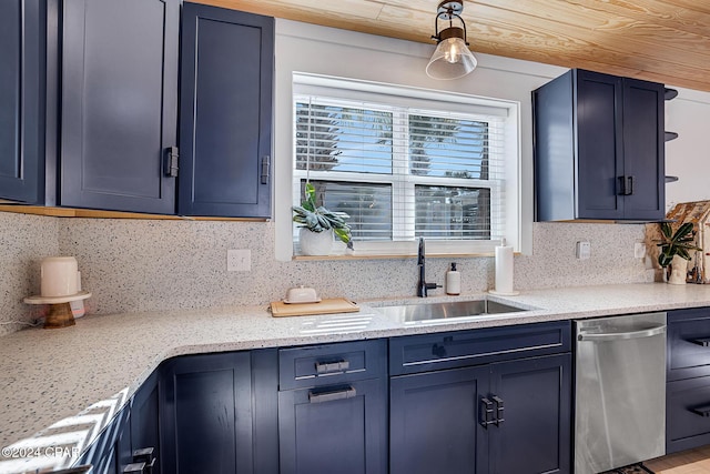 kitchen with sink, stainless steel dishwasher, decorative backsplash, blue cabinetry, and light stone counters