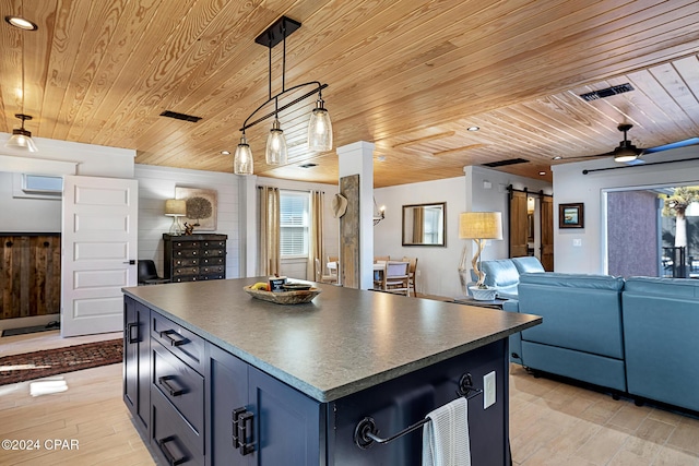 kitchen featuring pendant lighting, a center island, ceiling fan, and wooden ceiling