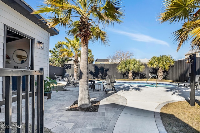 view of swimming pool featuring a patio