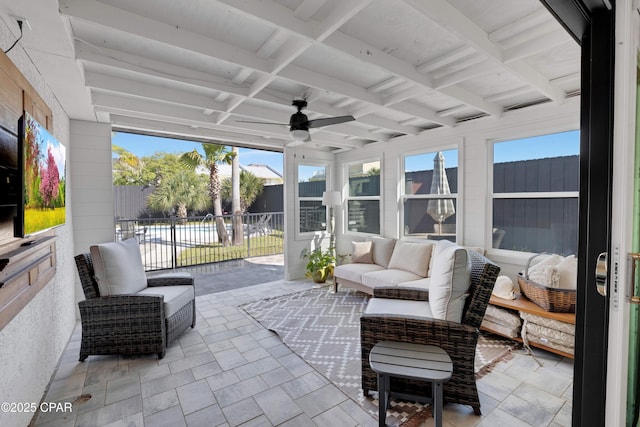 sunroom / solarium with ceiling fan, beamed ceiling, and coffered ceiling