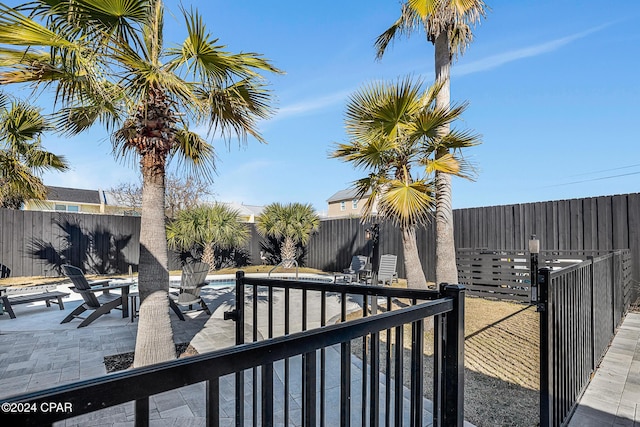 exterior space featuring a patio area and a fenced in pool