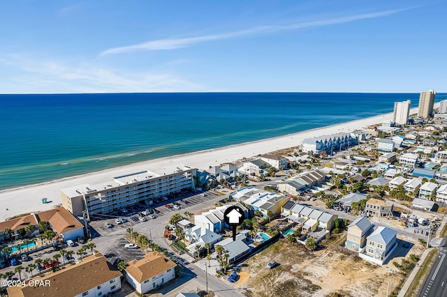 aerial view featuring a view of the beach and a water view