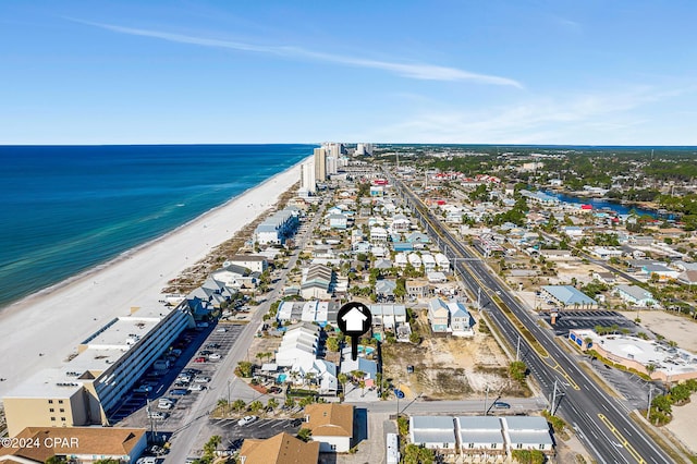 drone / aerial view with a water view and a view of the beach