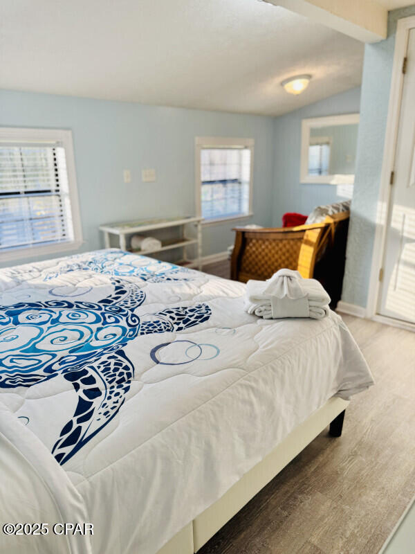 bedroom featuring lofted ceiling