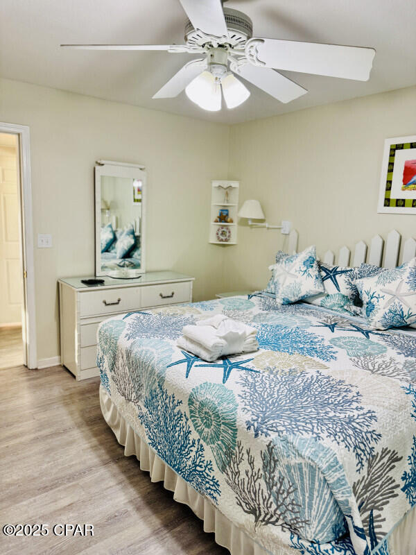 bedroom featuring ceiling fan and light hardwood / wood-style floors